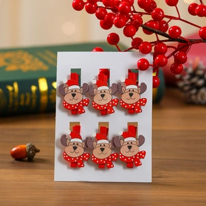 Set of 6 Christmas reindeer wooden clips on white card for festive photo wall decor