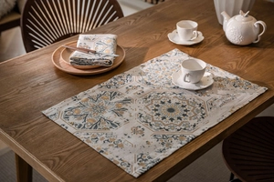 Detail of vintage mandala pattern placemat on wood table with cotton linen texture