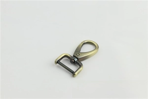 Detail of vintage bronze metal swivel lobster clasp for handbag straps and keychains