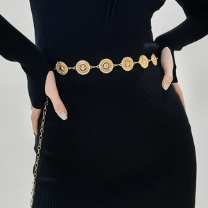 Minimalist gold metal chain belt with hollow geometric discs on black dress