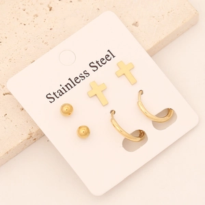 Lot de trois paires de boucles d'oreilles en acier inoxydable doré à motifs de croix