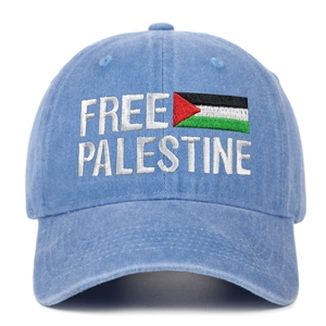 Close-up of Free Palestine embroidery and national flag on light blue washed cotton cap
