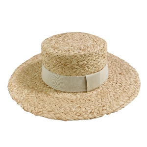 Foldable wide brim raffia straw hat with cream ribbon for summer beach vacations