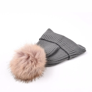 Winter rib-knit ear-protection beanie in grey with large detachable brown faux fur pompom