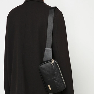 Chic black quilted leather crossbody chest bag for women with golden zipper and adjustable strap