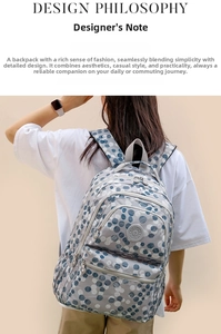 Polka dot pattern backpack with multiple zipper compartments shown in detailed profile