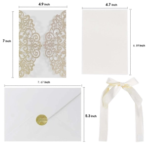 Detailed set of champagne gold laser cut invitations with cream inner cards and envelopes