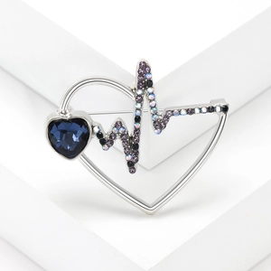 Silver heartbeat brooch with blue heart gem and purple gradient rhinestones