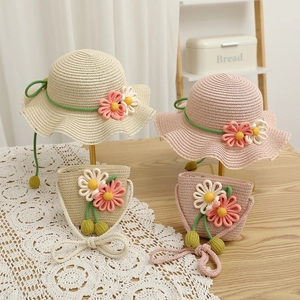 Sweet children's straw hat and bag set with lace trim and crochet flowers for summer
