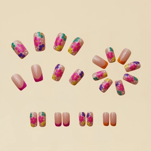 Short square press-on nails with colorful spring floral patterns and French design