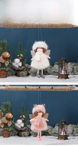 Detail of plush Christmas angel ornaments in pink and white with sequined wings