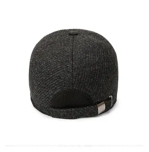 Detail view of the back of a grey winter baseball cap with metal adjustable strap
