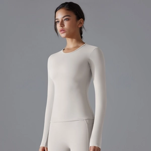 Close-up of slim-fit yoga long sleeve top in off-white high-elastic fabric for fitness