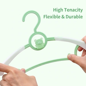 Durable mint green baby clothes hanger with flexible plastic and cartoon bear design