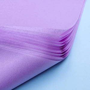 Detailed texture of purple tissue paper with elegant curled edges for flower bouquet wrapping