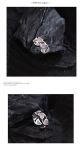 Detailed macro view of silver open ring featuring multiple pink enamel heart-shaped motifs