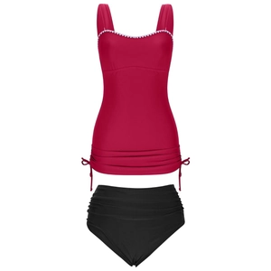 Detail of red tankini top with white scalloped trim and adjustable side drawstring