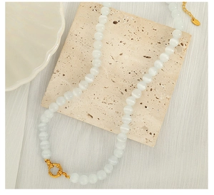 Detailed shot of beaded opal necklace with golden OT clasp and adjustable extension chain