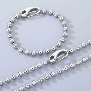 Detailed view of silver 6mm bead chain bracelet and necklace with spring clasps