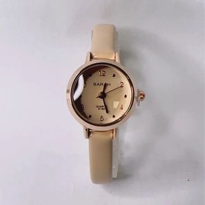 Detail of BARAH 8169 quartz watch featuring a champagne gold dial and beige leather strap