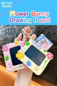 Macro view of cute flower-themed electronic drawing board keychain with bunny details.
