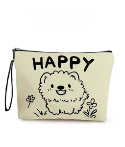 Detailed close-up of canvas makeup bag featuring happy cartoon puppy pattern and strap
