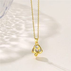 Gold mushroom pendant necklace with three clear zircon stones on a sleek cable chain