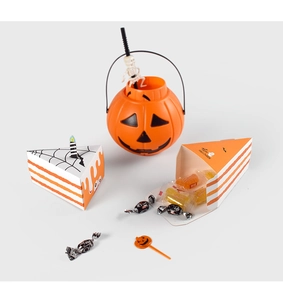 Detail of triangle Halloween cake gift boxes and pumpkin pail with Happy Halloween text