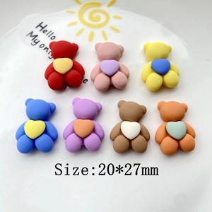 Macro detail of multi-colored heart-holding bear DIY resin accessories sized 20x27mm