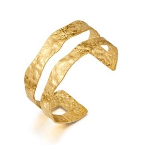 Detailed close-up showing the double-layer hammered texture of the 18K gold-plated cuff