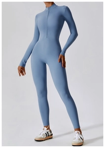 Detail of high-stretch light blue yoga bodysuit featuring a half-zip neckline and sleek fit