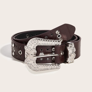 Close-up of brown faux crocodile belt with rhinestone butterfly buckle and star studs