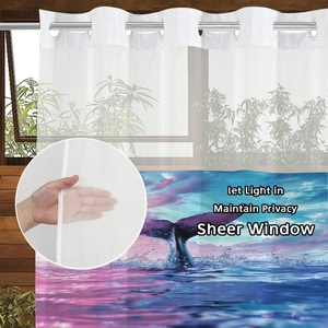 Detail of sheer window curtain with whale tail print and metal grommet top design