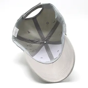 Detail view of the 100% acrylic 6-panel interior and adjustable velcro strap of grey cap