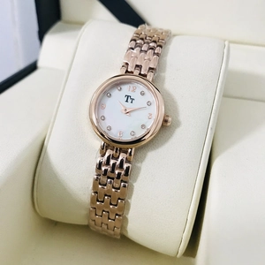 Elegant rose gold women's watch with thin mesh strap and crystal hour markers