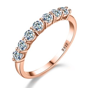 Detail shot of rose gold S925 silver ring featuring eight sparkling round moissanite stones