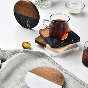 Elegant marble and acacia wood coasters in round and square shapes for home decor