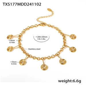 Macro detail of golden stainless steel bracelet with spiral charms and sizing info