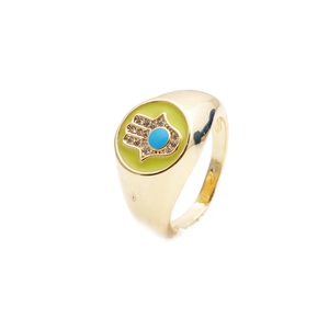 Golden Hamsa hand open ring with green enamel and blue gemstone on white background