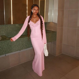Detail view of the pink ruffles and slim fit elastic fabric of the long-sleeve dress