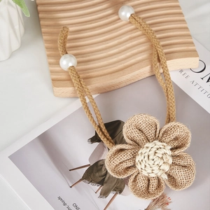 Handmade burlap flower curtain tieback with jute rope and white faux pearl accents