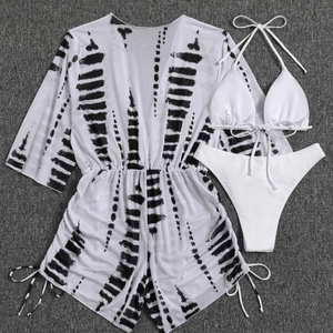 Three-piece bikini set with black and white tie-dye drawstring cover-up and white swimsuit