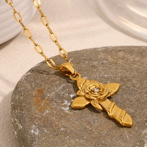 Detailed close-up of 18K gold plated cross pendant with center rose flower and diamond