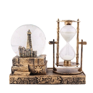 Vintage hourglass with crystal ball tower and bronze base for desktop decoration
