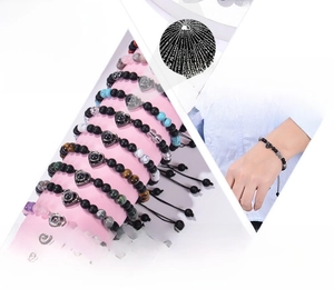 Detail view of handmade beaded heart bracelets with 100 languages projection stone