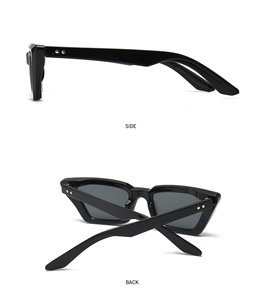 Detailansicht der schwarzen rechteckigen Sonnenbrille mit markanten goldenen Sternnieten