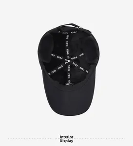 Detail view of the black baseball cap interior featuring reinforced FAKS logo stitching