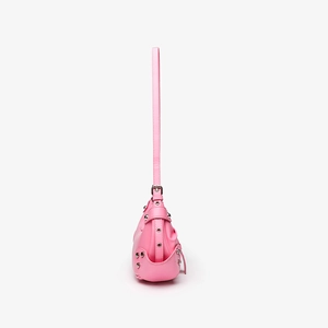 Side view of pink faux leather shoulder bag featuring silver rivets and metal hardware