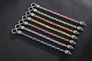 Detailed view of colorful stainless steel skull bracelets in multiple vibrant finishes