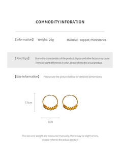 Detailed view of rhinestone drop hoop earrings showing dimensions and materials